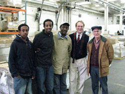 Mr. Yohannes Gebregeorgis of Ethiopia (center), one of ten CNN Heroes for 2008, tours the BFA warehouse in December 2008.