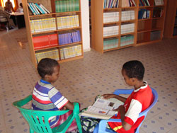 Children read their BFA books at the new library/community center in Garowe, Somalia.