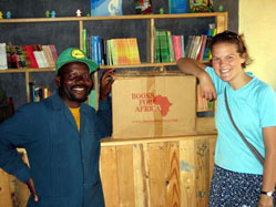 Courtney Smith, a college student living in Minnesota, helps unpack books from a shipment to Tanzania that she organized.