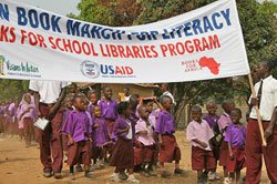 Students attend the kickoff of the Books For School Libraries program at an elementary school in Monrovia, Liberia.