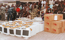 A formal ceremony upon receipt of a BFA shipment of computers and books at the University of Ghana.