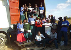 Our partnering recipients in the Maguliwa Area Secondary School in Tanzania unpack books from a 40-foot container that arrived recently.