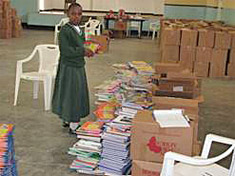 Student volunteer and book lover Jacqueline, who helped sort a BFA shipment of books in Tanzania.