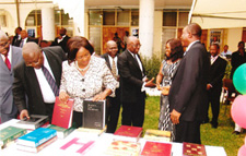 Chief Justice Examining the Books with Martin Amidu (Also pictured: Nana Fredua Owusu Agyeman, Registrar of the Law School and Nene Amegatcher, Member of the ABA's SIL Africa Committee and Lecturer at the Ghana School of Law)
