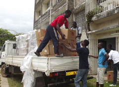 Students of Université Omar Bongo break down pallets to place in LAGRAC (Mapping and Graphics Laboratory) at the Université Omar Bongo.