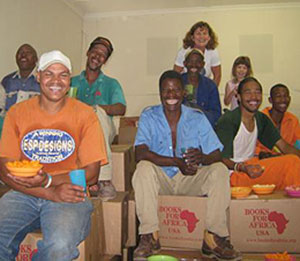 Students at Eden Campus in South Africa unload boxes of Books For Africa books.