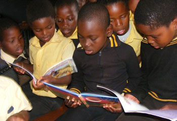 Students in the Eshowe region of South Africa reading their books sent thanks to Oprah's Angel Network.