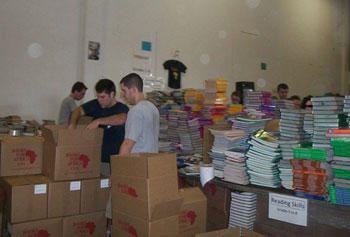 Georgia State University law students sort and pack books at the BFA warehouse in Atlanta.