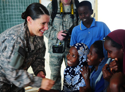 A U.S. Marine Greets Students at Chabellier School in Djibouti.