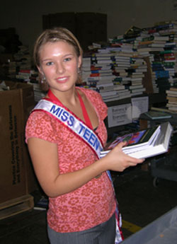 Carlene Miller, Miss Teen of America, sorts books at BFA's warehouse in Atlanta.