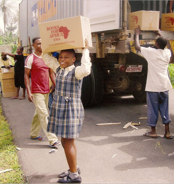 Students at Saint Martin De Porres Girls' College in Nigeria unload BFA boxes.