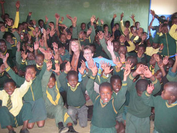 Tammie Follett (Thomson Reuters) and Robin Coquyt (Medtronic) visit schoolchildren in South Africa.