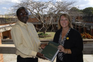 Tammie Follett presents a Black’s Law Dictionary to the Dean of the law school at the University of Malawi on behalf of Thomson Reuters.