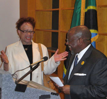 The Honorable Ombeni Sefue, Tanzanian Ambassador to the U.S., introduces Dr. Sarah Moten (on left), former Chief of the Education Division of the United States Agency for International Development.