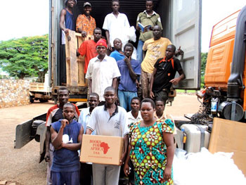 Unloading the books in Uganda.