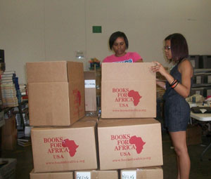 Volunteers from Upward Bound in Ohio sort and pack BFA books for shipment to Africa.