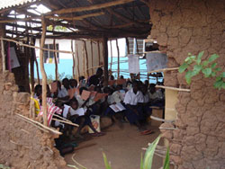 The BFA delegation to Tanzania conducted school visits in February of 2006. This is a photo of a typical school in Tanzania, East Africa with classes conducted in mud huts