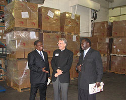 Pictured above in front of books earmarked for delivery to Hanga Abbey, Tanzania are Tanzanian Ambassador to the U.S. Andrew Daraja; Father Robert Koopman of St. John’s Abbey, Collegeville; and Tanzanian Deputy Minister for Foreign Affairs and International Cooperation Dr. Cyril August Chami. The group participated in the grand opening of Books For Africa's new warehouse on September 27, 2006.