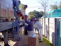 Volunteers help to unload delivered books